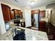 Practical kitchen boasting stainless steel appliances, granite countertops, and a convenient layout at 916 Roxburgh Ave, Rock Hill, SC 29732