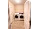 Well-organized laundry room features a washer, dryer, and storage shelf, offering functionality and convenience at 916 Roxburgh Ave, Rock Hill, SC 29732