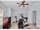 Bright bedroom with home gym setup and ceiling fan at 5003 Sharon Rd # L, Charlotte, NC 28210