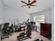 Spacious bedroom with home office, exercise equipment and ceiling fan at 5003 Sharon Rd # L, Charlotte, NC 28210