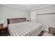 King-size bed in this well-lit bedroom with ample closet space at 5003 Sharon Rd # L, Charlotte, NC 28210