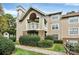 Exterior view of condo building with landscaping at 5003 Sharon Rd # L, Charlotte, NC 28210