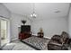 Living room with vaulted ceiling, fireplace, and leather seating at 5003 Sharon Rd # L, Charlotte, NC 28210