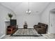 Living room with vaulted ceiling, fireplace, and leather seating at 5003 Sharon Rd # L, Charlotte, NC 28210