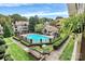 Community pool with surrounding landscaping and residential buildings at 5003 Sharon Rd # L, Charlotte, NC 28210