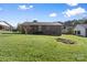 Exterior view of the back of the home and the large yard at 927 Kearney Dr, Shelby, NC 28152