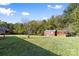 Large grassy backyard with storage sheds at 927 Kearney Dr, Shelby, NC 28152