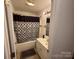 Neat bathroom with shower-tub combo and neutral fixtures at 927 Kearney Dr, Shelby, NC 28152