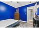 Cozy bedroom with blue walls and classic wooden dresser at 927 Kearney Dr, Shelby, NC 28152