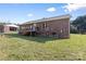 Exterior view of the back of the home and the large yard at 927 Kearney Dr, Shelby, NC 28152