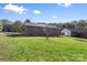 Exterior view of the back of the home and the large yard at 927 Kearney Dr, Shelby, NC 28152