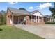 Side exterior view of the house with driveway and covered parking at 927 Kearney Dr, Shelby, NC 28152