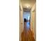 Long, narrow hallway featuring polished hardwood floors and natural light at 927 Kearney Dr, Shelby, NC 28152