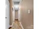 Hallway with hardwood floors leads to various rooms at 927 Kearney Dr, Shelby, NC 28152