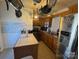 Charming kitchen with wooden cabinets, modern appliances, and hanging pot rack at 927 Kearney Dr, Shelby, NC 28152