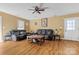 Cozy living room with hardwood floors, ceiling fan and a door to the exterior at 927 Kearney Dr, Shelby, NC 28152