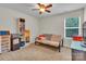 Cozy bedroom with futon, shelving, and window at 5267 Norway Ln, Rock Hill, SC 29732