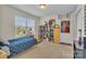 Bright bedroom featuring a twin bed, shelving, and window at 5267 Norway Ln, Rock Hill, SC 29732