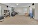 Bonus room with game table, seating, and basketball hoop at 5267 Norway Ln, Rock Hill, SC 29732