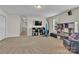 Spacious bonus room with TV, seating, and storage at 5267 Norway Ln, Rock Hill, SC 29732