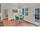 Bright dining area with a charming wooden table and teal chairs at 5267 Norway Ln, Rock Hill, SC 29732