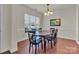 Dining room with hardwood floors and oval dining table at 5267 Norway Ln, Rock Hill, SC 29732