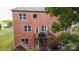 Brick house back with deck, playground, and partial water view at 5267 Norway Ln, Rock Hill, SC 29732