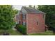 Three-story brick house with partial view of yard and driveway at 5267 Norway Ln, Rock Hill, SC 29732