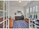 Home office with french doors, hardwood floors, and built-ins at 5267 Norway Ln, Rock Hill, SC 29732