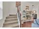 Stylish carpeted staircase with a modern metal railing at 5267 Norway Ln, Rock Hill, SC 29732