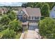 Two-story home with stone accents and a two-car garage at 4043 Orchid Way, Tega Cay, SC 29708