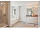 Elegant bathroom with soaking tub, shower, and granite vanity at 4043 Orchid Way, Tega Cay, SC 29708