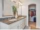 Double vanity bathroom with granite countertop and access to closet at 4043 Orchid Way, Tega Cay, SC 29708