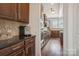 Well-equipped kitchen with dark wood cabinets and granite counters at 4043 Orchid Way, Tega Cay, SC 29708