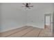 Bright bedroom featuring a ceiling fan and unfinished flooring at 6217 Long Branch Rd, Salisbury, NC 28147