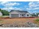 Newly constructed home with two-car garage, light blue vinyl siding and black roof at 6217 Long Branch Rd, Salisbury, NC 28147