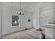 Bright breakfast area with white cabinets, stainless steel appliances, and gray granite countertops at 6217 Long Branch Rd, Salisbury, NC 28147