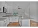 Bright kitchen with white cabinets, stainless steel appliances, gray granite countertops, and open floor plan at 6217 Long Branch Rd, Salisbury, NC 28147