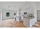 Bright kitchen with white cabinets, stainless steel appliances, and gray granite countertops at 6217 Long Branch Rd, Salisbury, NC 28147