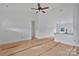 Bright living room featuring high ceilings, open floor plan, white walls, and a ceiling fan at 6217 Long Branch Rd, Salisbury, NC 28147