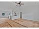 Bright living room featuring high ceilings with fan, open floor plan, and unfinished flooring at 6217 Long Branch Rd, Salisbury, NC 28147