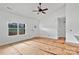 Bright living room featuring high ceilings, a door to the backyard, and open to the kitchen at 6217 Long Branch Rd, Salisbury, NC 28147