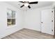 Bedroom featuring a ceiling fan, light wood laminate flooring, and one window at 6259 Long Branch Rd, Salisbury, NC 28147