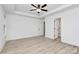 An open bedroom with a ceiling fan and light wood laminate flooring at 6259 Long Branch Rd, Salisbury, NC 28147