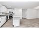 Bright kitchen featuring white cabinets, stainless steel appliances, granite counters, and an island at 6259 Long Branch Rd, Salisbury, NC 28147