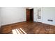 Spacious bedroom featuring hardwood floors, light walls, and a vintage style at 2001 Mcdonald Dr, Charlotte, NC 28216