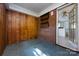 Enclosed patio featuring brick walls, paneled siding, and linoleum flooring at 2001 Mcdonald Dr, Charlotte, NC 28216