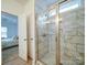 Bathroom with a shower and marble-look tile at 2613 Plyler Mill Rd, Monroe, NC 28112