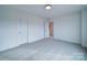 Bright bedroom featuring carpeted floors and neutral walls at 2613 Plyler Mill Rd, Monroe, NC 28112