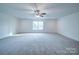 Bright bedroom with ceiling fan and window at 2613 Plyler Mill Rd, Monroe, NC 28112